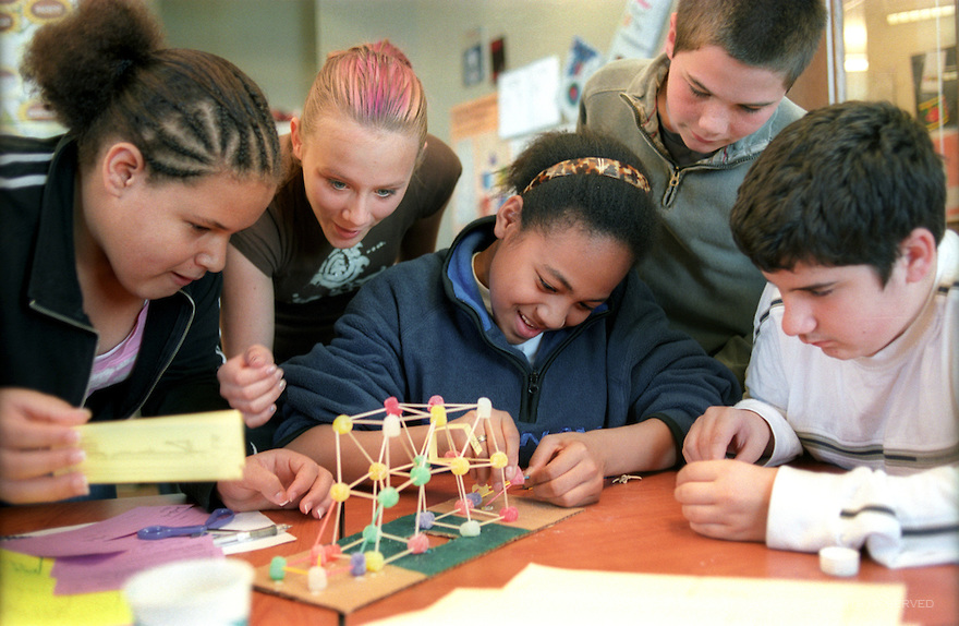 An image showing a group of students working together to build a model construction