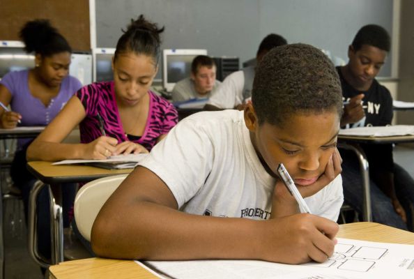An image showing students working at desks