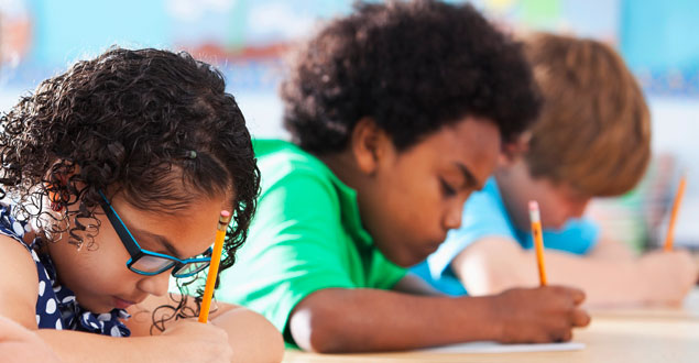 An image of two students writing