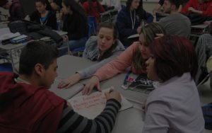An image showing a group of students working on a group task